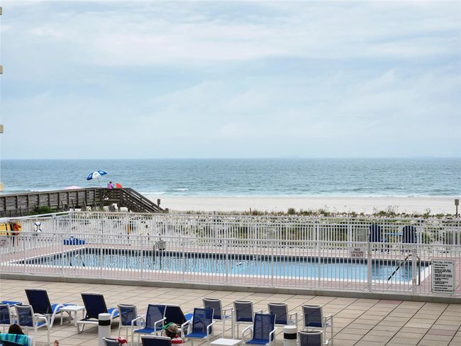 Community pool with view of Ocean and beach and a Patio area | Image 10
