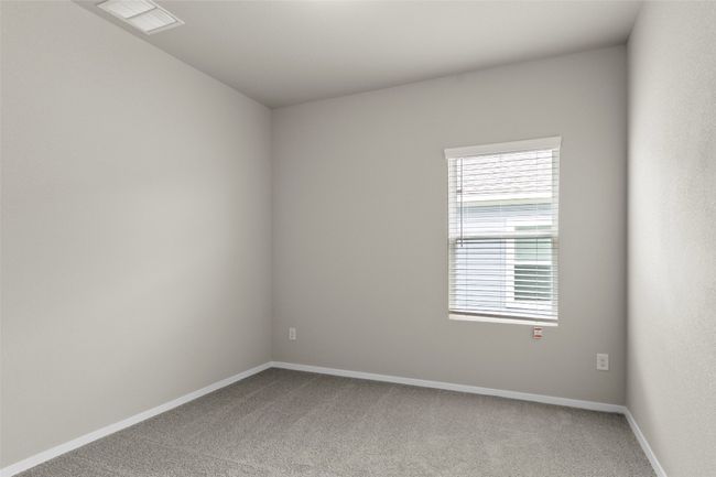 Carpeted empty room featuring baseboards and visible vents | Image 25