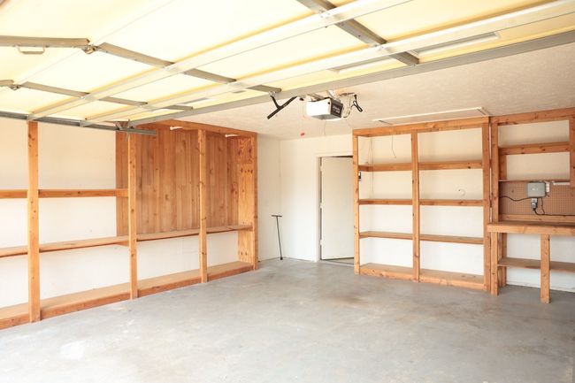 Garage featuring a garage door opener | Image 24