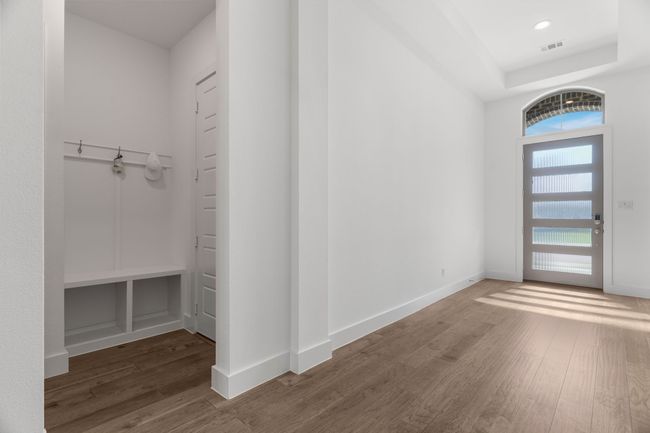 Entryway featuring wood finished floors, baseboards, and recessed lighting | Image 10