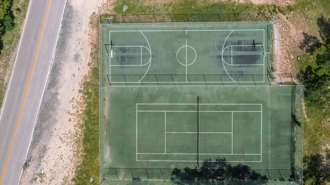 Aerial view of the tennis and basketball courts in Apache Shores | Image 28