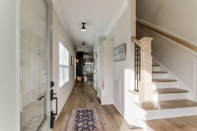 Beautiful (only 2 years old/new) construction comes turn key ready with custom window treatments, established yard, refrigerator, washer & dryer, encapsulated crawlspace... convenient drop zone in the entrance hall. | Image 3