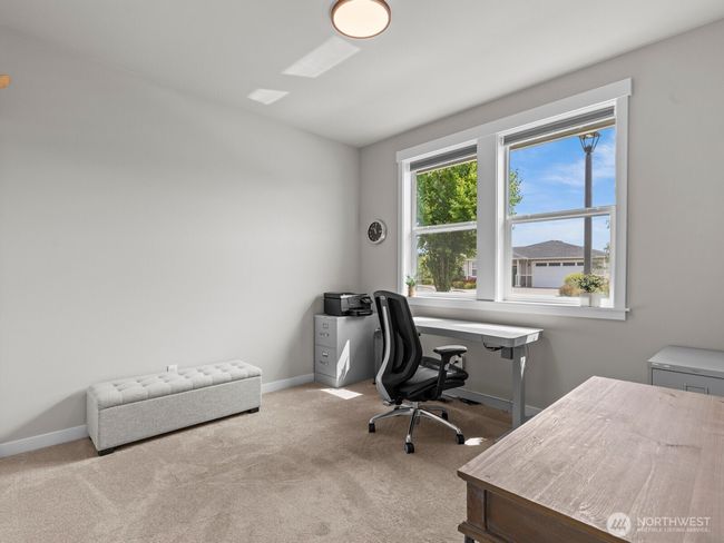 Immediately to your right is the 1st bedroom, perfect for a home office. | Image 4