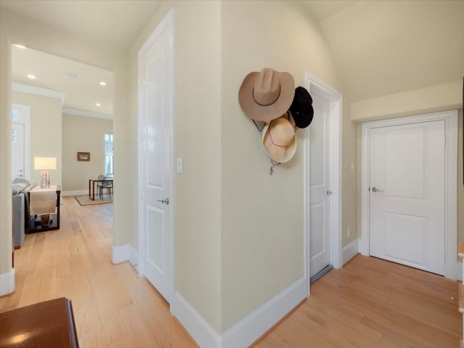 Corridor featuring light wood-type flooring, baseboards, recessed lighting, and ornamental molding | Image 18