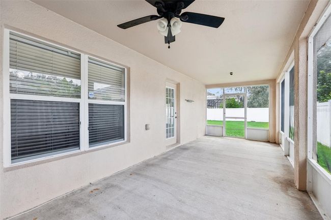 Covered & screened side porch in the backyard | Image 21