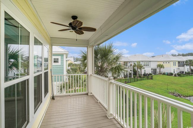 Balcony with a residential view and ceiling fan | Image 14