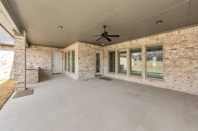 View of patio featuring ceiling fan | Image 34