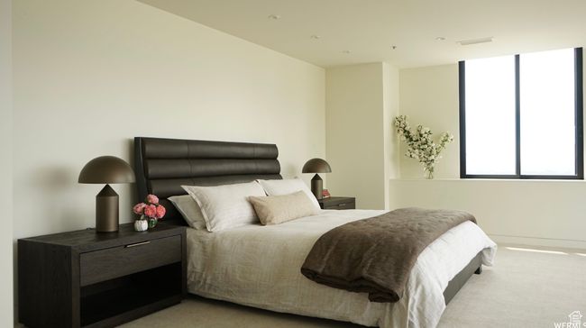 Bedroom featuring visible vents and carpet flooring | Image 16