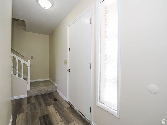 Hallway featuring wood finished floors and stairway | Image 25