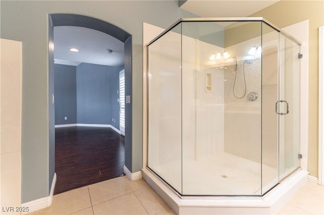 Full bathroom featuring a stall shower, baseboards, and tile patterned flooring | Image 28