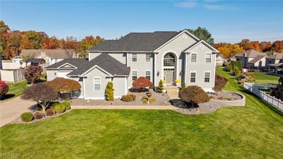 View of front facade with a front lawn | Image 1