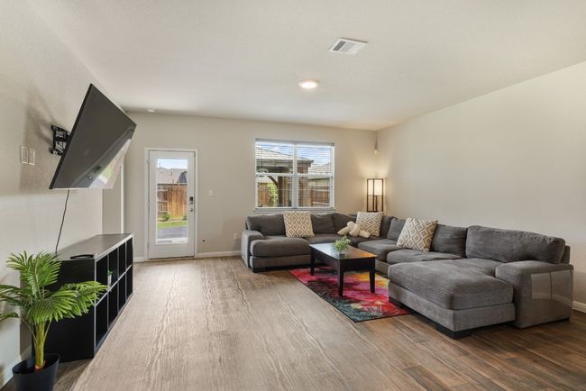 Spacious Living Room/Great Room overlooks the gazebo and gardens. | Image 8