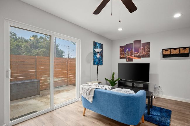 Living room with plenty of natural light, ceiling fan, and recessed lighting | Image 10