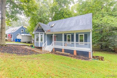 View of front of house with a front lawn and covered porch | Image 2