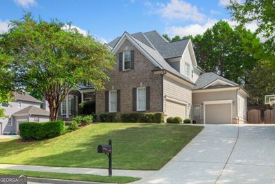 Three car garage and plenty of driveway for multiple vehicles and your golf cart! | Image 2