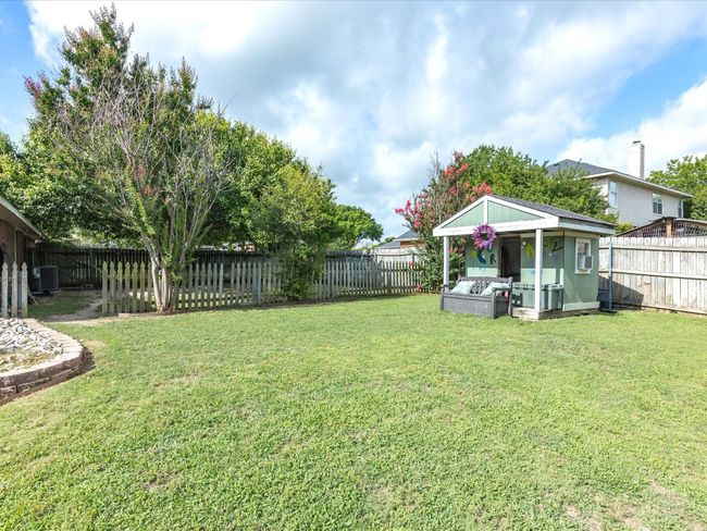 View of fenced backyard | Image 36