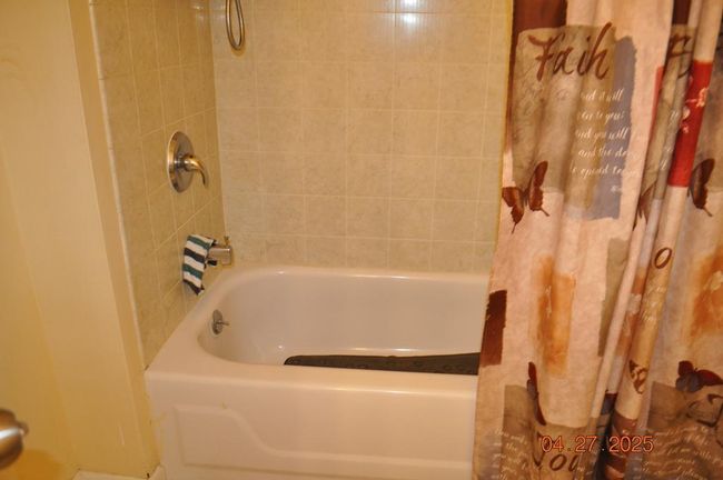 bath with shower | Image 10