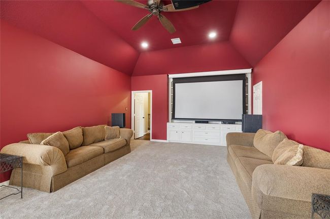 Movie nights take center stage in the dedicated media room, complete with projector and theatre-style ambiance, complete with projector, surround sound, and subwoofer all updated in 2022. | Image 35