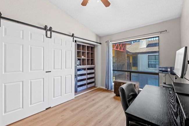 The closet is equipped with a storage system. | Image 21