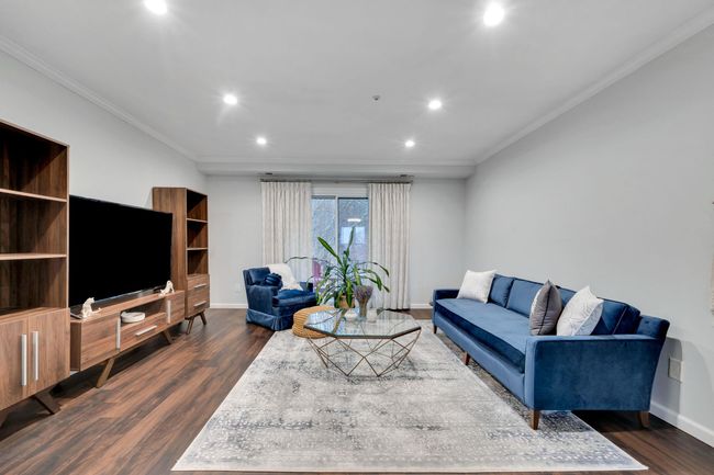 Living room with recessed lighting, ornamental molding, baseboards, and dark wood finished floors | Image 8