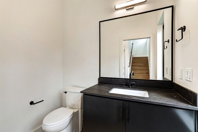 Bathroom featuring vanity and toilet | Image 13