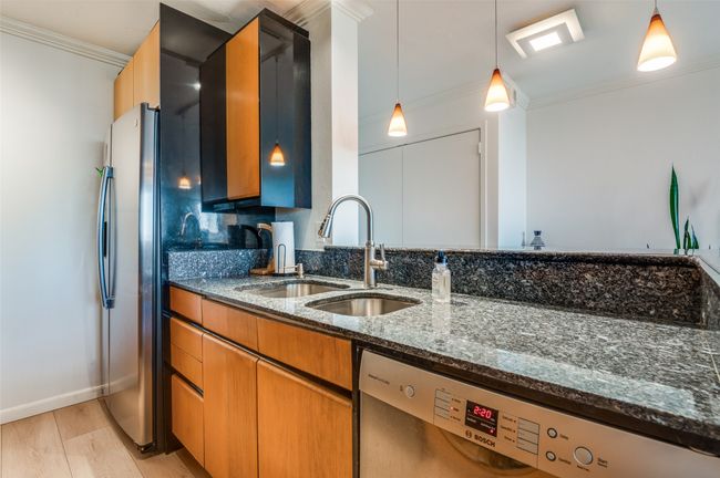 Meticulously Maintained Kitchen with Stainless Steel Appliances and Gas Range | Image 10