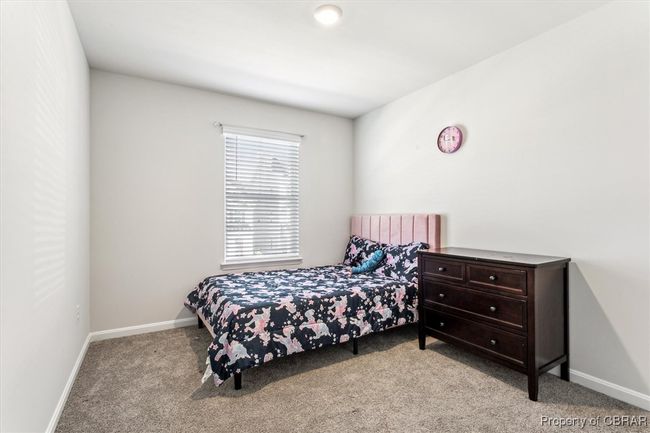 Bedroom with baseboards and carpet | Image 23