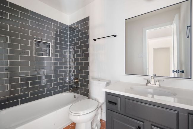 A second guest bathroom offers modern finishes, ample counter space, and easy access from adjacent bedrooms, ensuring comfort and convenience for visitors or family members. | Image 27