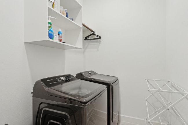 Laundry room with independent washer and dryer and baseboards | Image 35