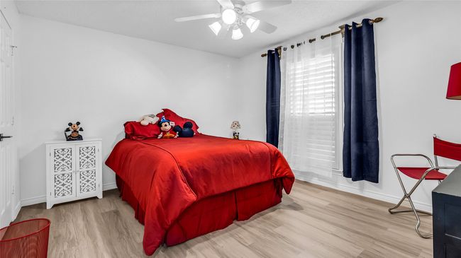 Bedroom featuring wood finished floors and a ceiling fan | Image 18