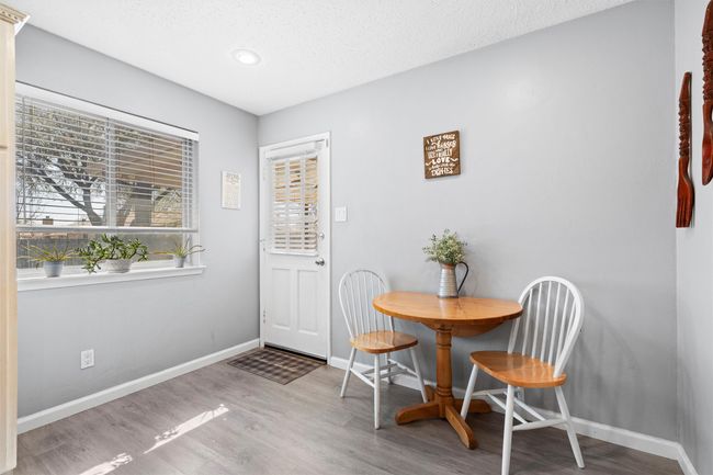bistro dining area in kitchen leads to backyard/patio | Image 10
