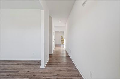 Hallway with dark hardwood / wood-style floors | Image 3