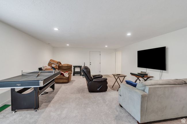 Carpeted living area featuring recessed lighting | Image 18