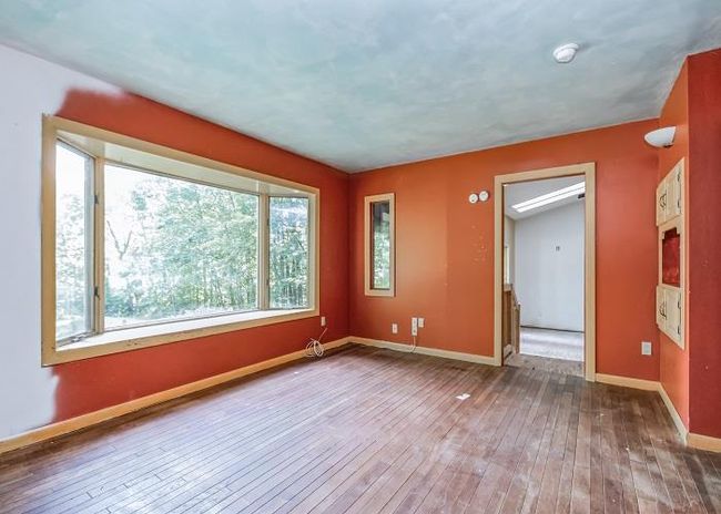 Empty room with hardwood / wood-style floors | Image 11