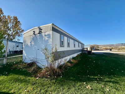 View of side of property featuring a yard | Image 2