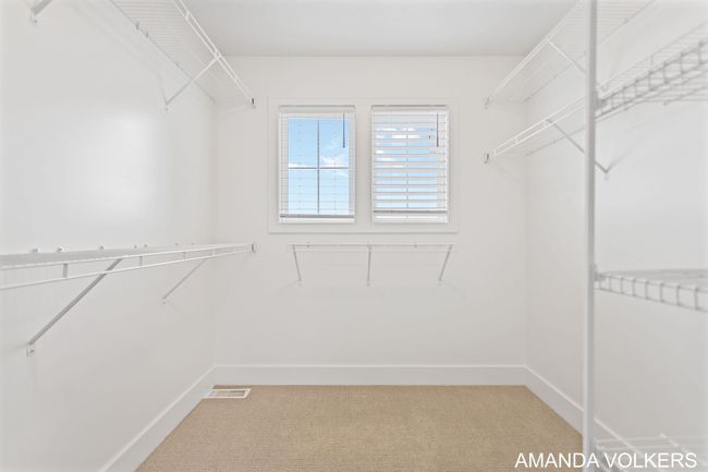 Primary large walk in closet | Image 34