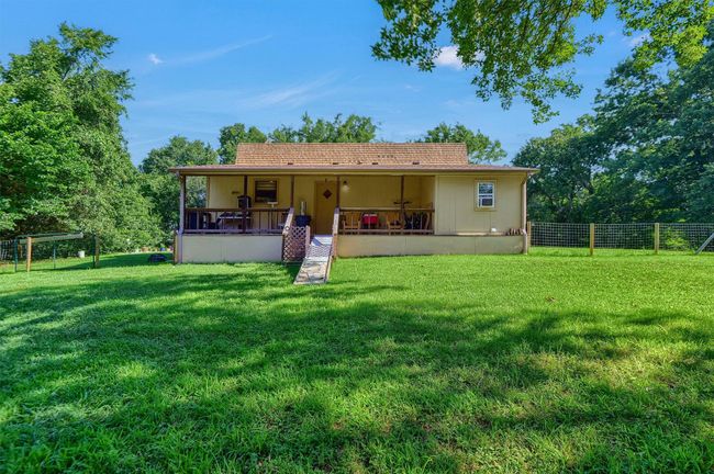 Back of property with a lawn and fence | Image 27