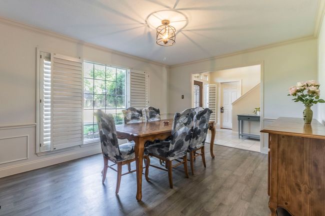 Dining area with crown molding and wood finished​​‌​​​​‌​​‌‌​‌‌​​​‌‌​​‌‌​‌​​​​​‌ floors | Image 9