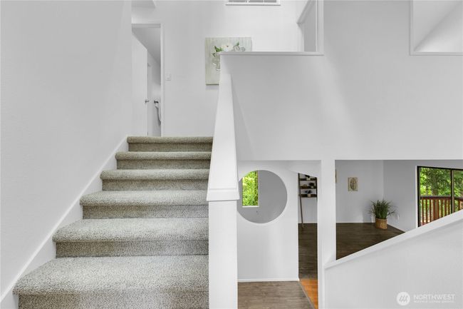 Stairs up from entry to bedrooms | Image 23
