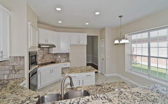 Kitchen Boasts Granite Countertops, SS Appliances, Corning Cooktop And Sunny Breakfast Area. | Image 13