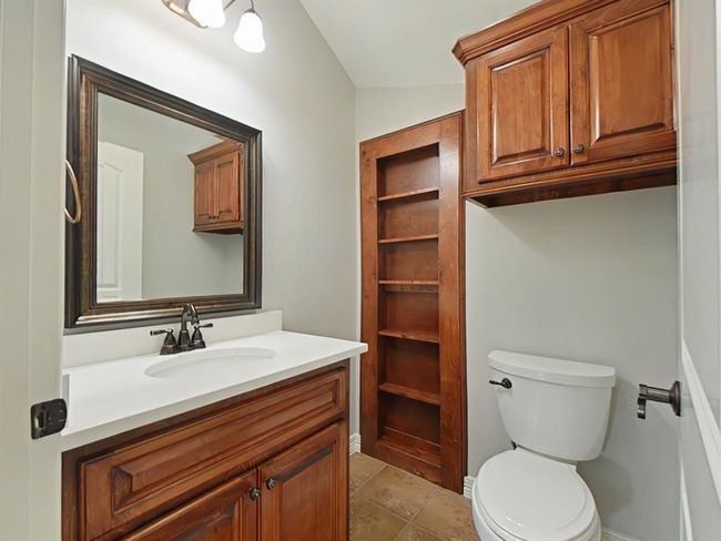 Convenient half bath enhancing the downstairs living area with newly installed quartz countertops and new sink. | Image 15