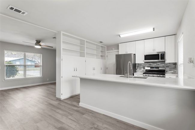 Dining Area looking into kitchen/living room | Image 9
