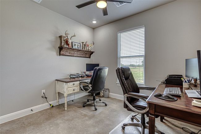 Home office featuring ceiling fan and plenty of natural light | Image 20