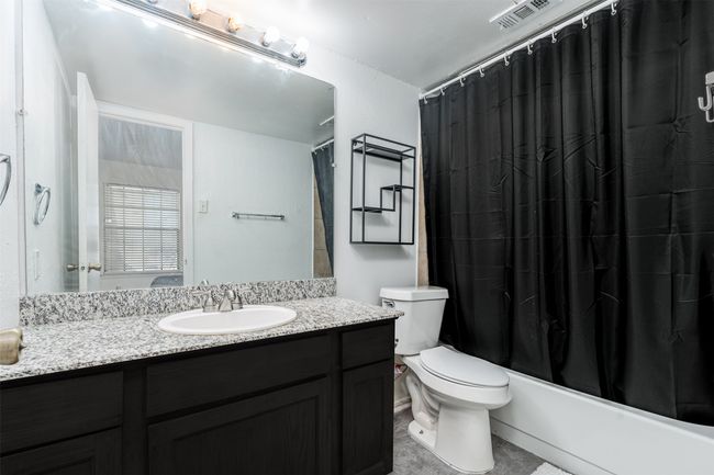 Full bath with vanity, toilet, and shower / bath combo | Image 13