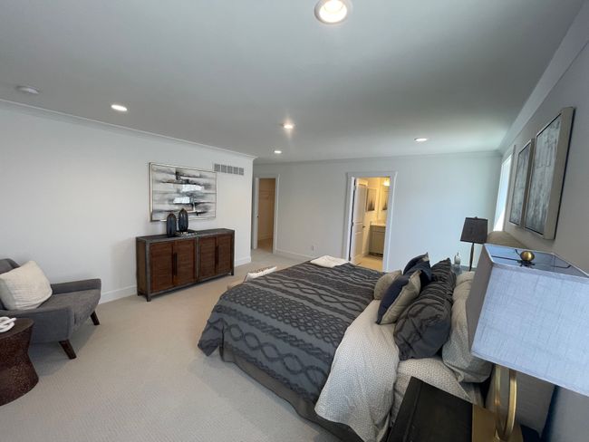Luxurious primary bedroom suite with spa like bath | Image 14