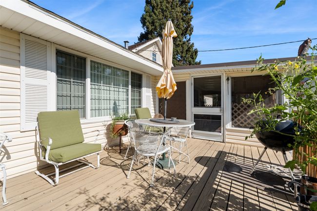 Wooden deck with outdoor dining space | Image 8