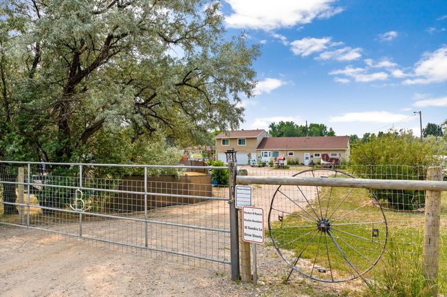 View of front of property featuring a gate and fence | Image 19