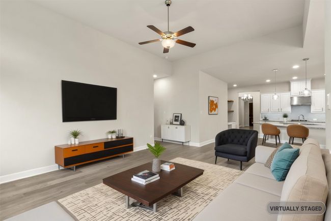 Virtually staged Living room featuring light wood-style flooring, a ceiling fan, recessed lighting, and baseboards | Image 16