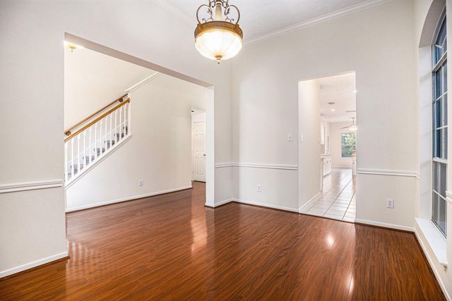 Additional view of formal dinning facing stair case and hall to indoor laundry room. | Image 13