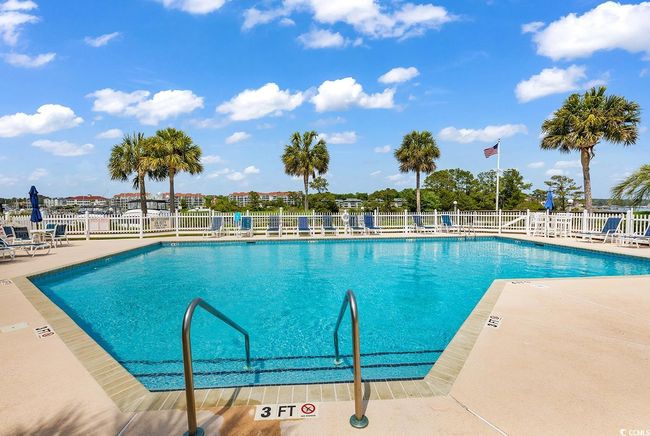 Pool with fence and a patio area | Image 35